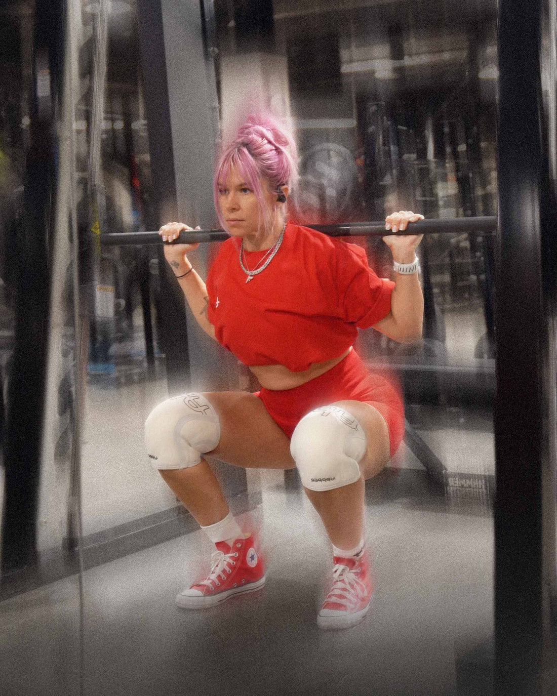 woman doing slow squats with uppper knee sleeves