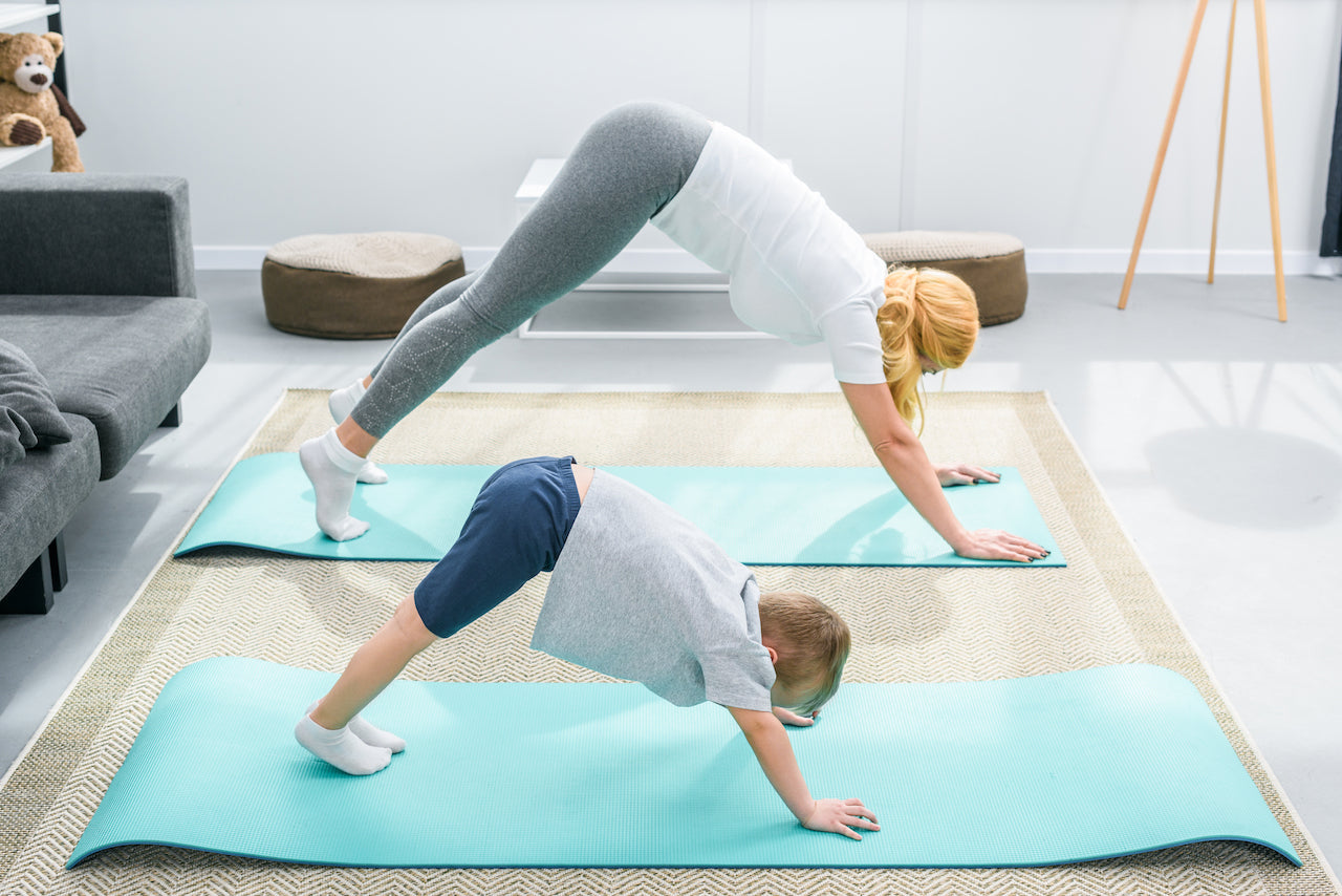 mother and son doing yoga while stuck at home