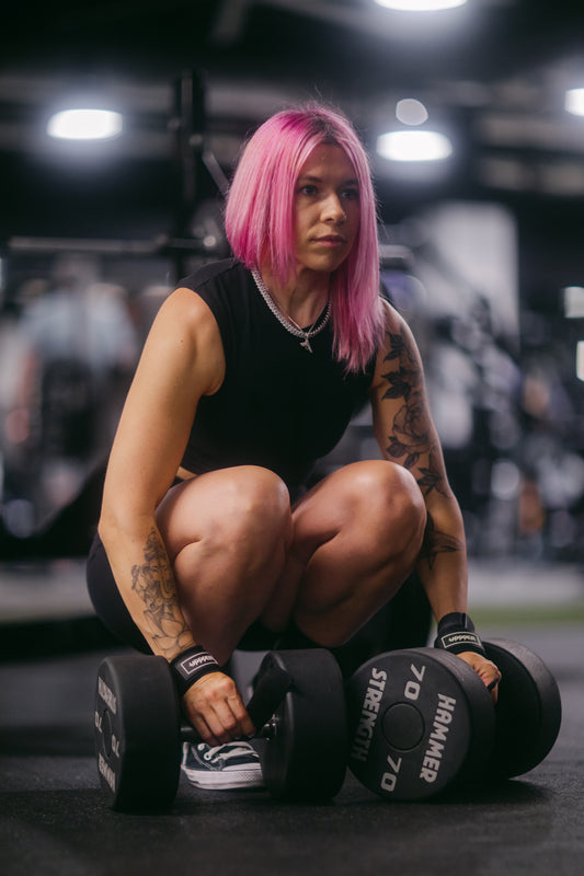 woman holding dumbbells