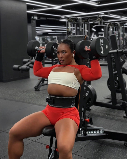 woman wearing wrist wraps when heavy weightlifting