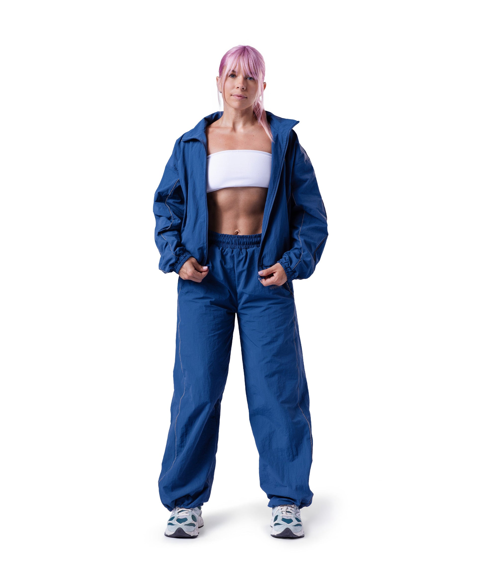 model wearing blue uppper track pants lifestyle shot